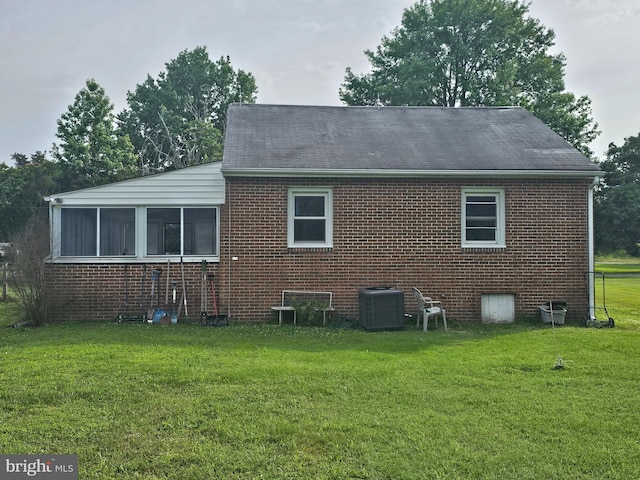 36652 Woodbush Dr, Bushwood, MD 20618 - rear view of property with brick siding, a lawn, and a shingled roof