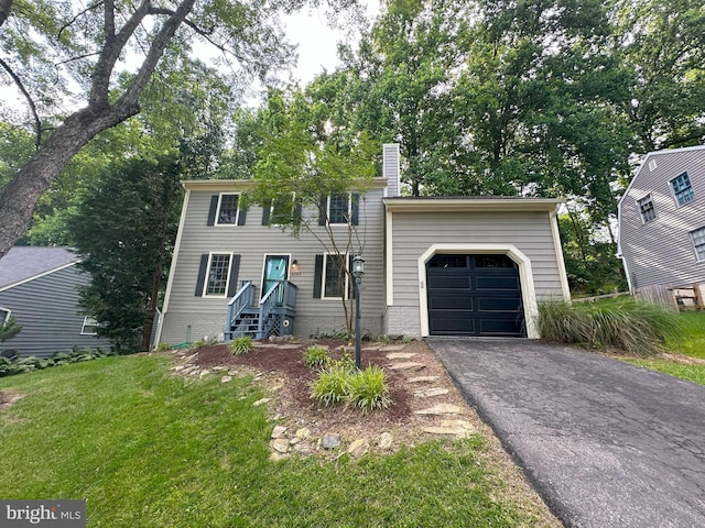 6848 Whistling Swan Way, New Market, MD 21774 - colonial home featuring a garage, asphalt driveway, a chimney, and a front yard