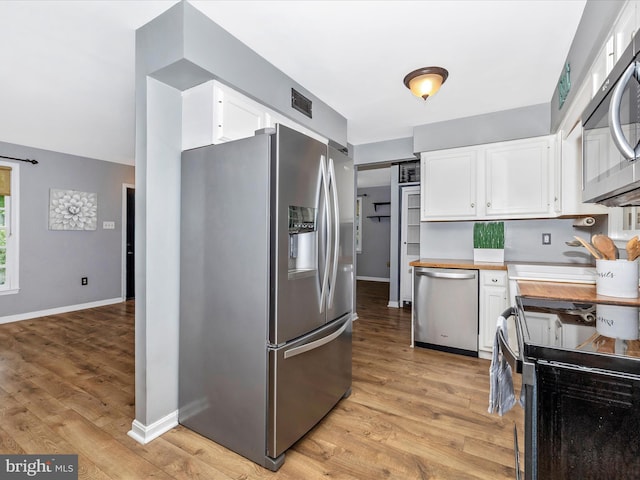 6848 Whistling Swan Way, New Market, MD 21774 - kitchen with appliances with stainless steel finishes, white cabinets, and light wood-type flooring