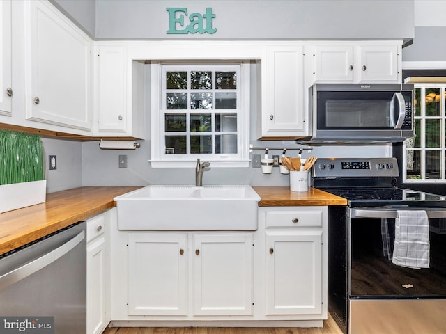 6848 Whistling Swan Way, New Market, MD 21774 - kitchen featuring stainless steel appliances, butcher block countertops, and white cabinetry