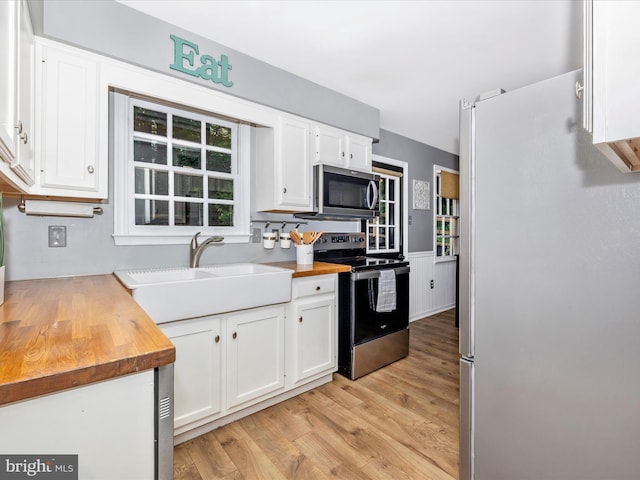 6848 Whistling Swan Way, New Market, MD 21774 - kitchen featuring stainless steel appliances, wood counters, white cabinets, and light wood-style floors