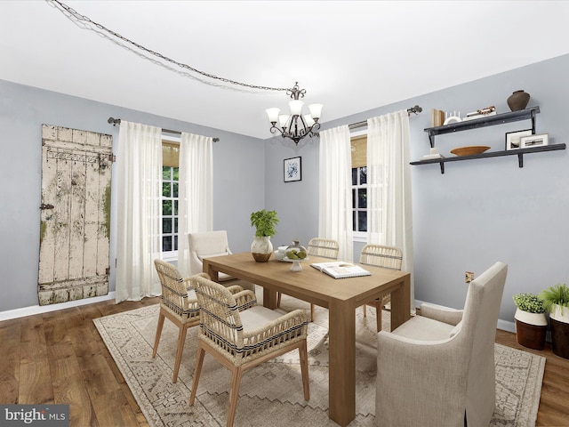 6848 Whistling Swan Way, New Market, MD 21774 - dining area with a chandelier and wood finished floors