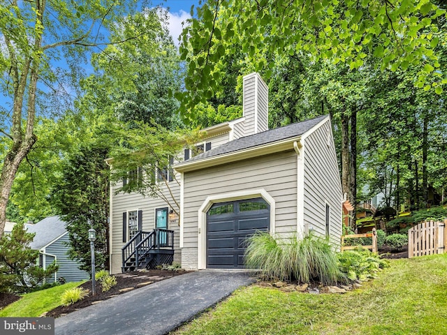 6848 Whistling Swan Way, New Market, MD 21774 - view of front of house featuring asphalt driveway, a chimney, and a shingled roof