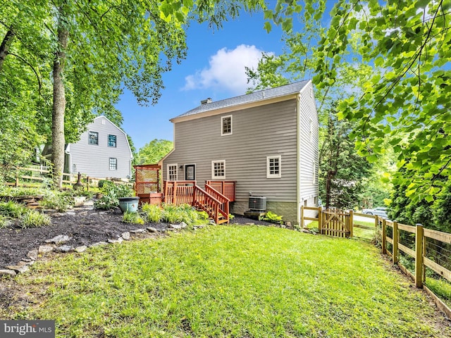 6848 Whistling Swan Way, New Market, MD 21774 - rear view of house featuring a wooden deck, a fenced backyard, stairs, and a gate