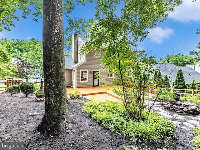 6848 Whistling Swan Way, New Market, MD 21774 - rear view of house with a wooden deck, a chimney, and roof with shingles