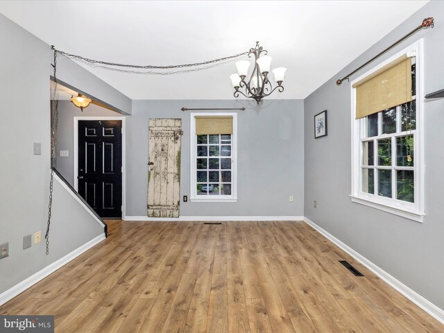 6848 Whistling Swan Way, New Market, MD 21774 - foyer entrance with a chandelier and wood finished floors