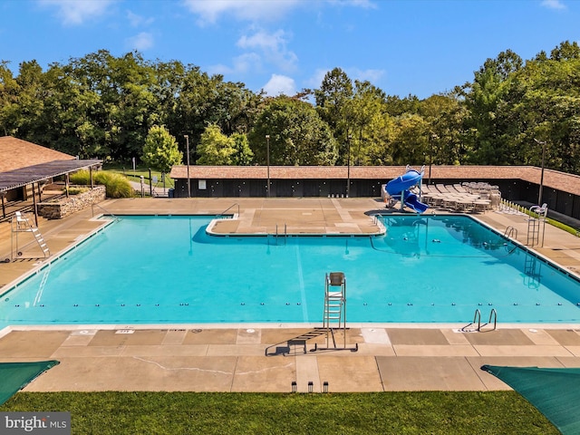 6848 Whistling Swan Way, New Market, MD 21774 - community pool featuring a water slide, a patio, and view of wooded area