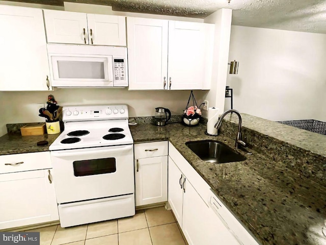13533 Demetrias Way, Germantown, MD 20874 - kitchen featuring white appliances, white cabinets, light tile patterned flooring, dark stone counters, and a textured ceiling