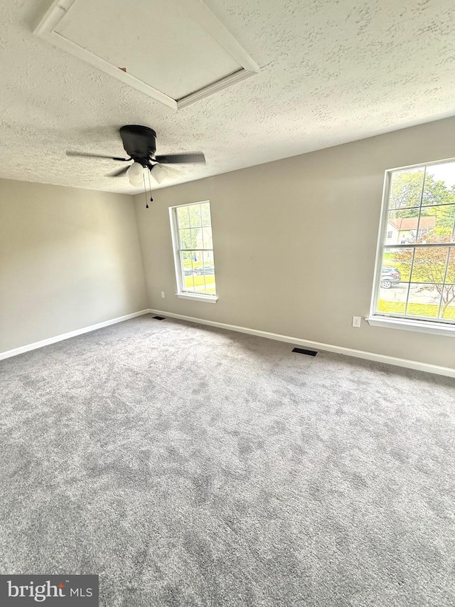 4850 Magpie Ln, Waldorf, MD 20603 - unfurnished room featuring a textured ceiling, baseboards, carpet flooring, and a ceiling fan
