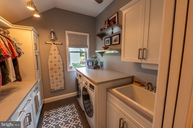 2440 Saddlebrook Rd, Macungie, PA 18062 - washroom featuring cabinet space, independent washer and dryer, dark tile patterned flooring, and baseboards