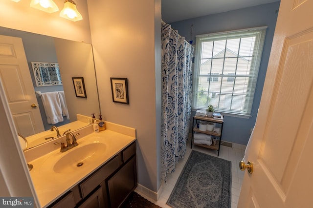 2440 Saddlebrook Rd, Macungie, PA 18062 - full bath featuring vanity, tile patterned floors, baseboards, and a shower with shower curtain