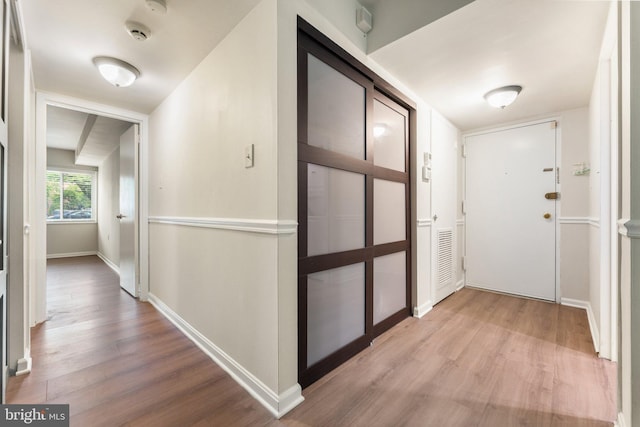1413 Northgate Sq Unit 13/2A, Reston, VA 20190 - hallway with light wood-style floors and baseboards
