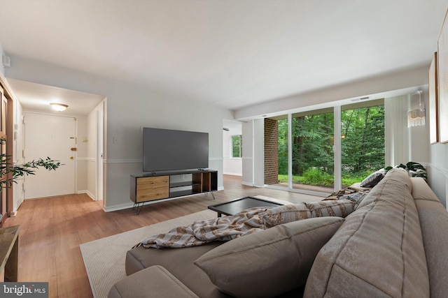 1413 Northgate Sq Unit 13/2A, Reston, VA 20190 - living area featuring wood finished floors and baseboards