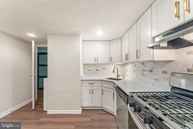 1413 Northgate Sq Unit 13/2A, Reston, VA 20190 - kitchen featuring stainless steel appliances, under cabinet range hood, dark wood-style flooring, white cabinetry, and recessed lighting