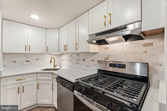 1413 Northgate Sq Unit 13/2A, Reston, VA 20190 - kitchen featuring appliances with stainless steel finishes, under cabinet range hood, white cabinets, light stone countertops, and backsplash