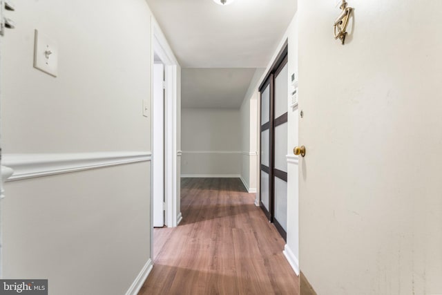 1413 Northgate Sq Unit 13/2A, Reston, VA 20190 - corridor with wood finished floors and baseboards