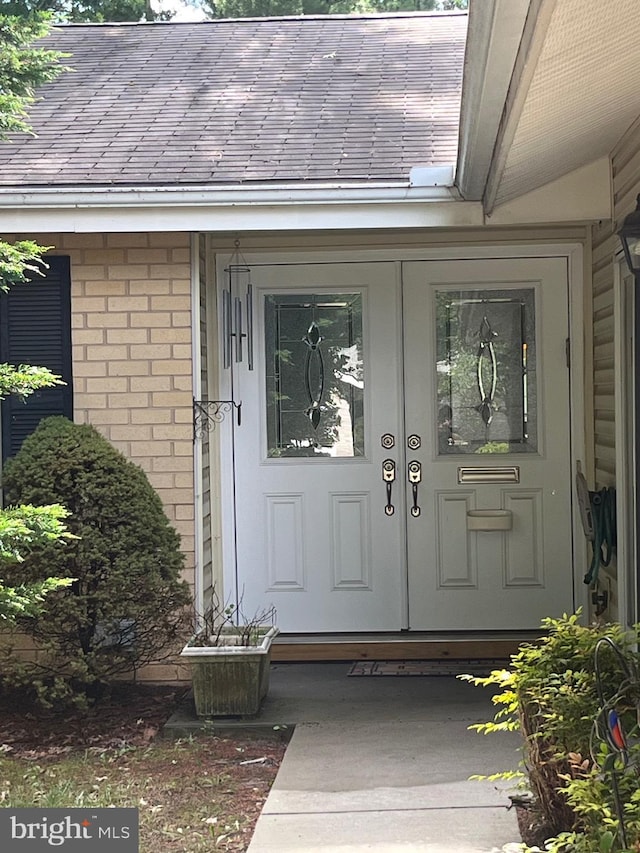 3300 Solomons Ct Unit 100, Silver Spring, MD 20906 - entrance to property featuring brick siding, french doors, and roof with shingles