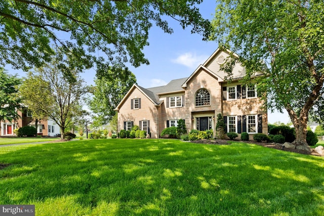 6 Windrose Cir, Doylestown, PA 18901 - traditional-style home featuring a front yard, brick siding, and stone siding
