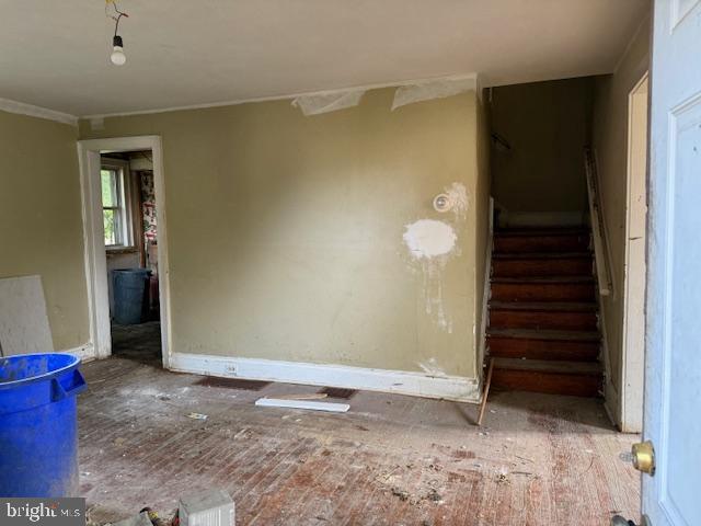 1404 Roanoke Rd, Camden, NJ 08104 - spare room featuring stairs, baseboards, and ornamental molding