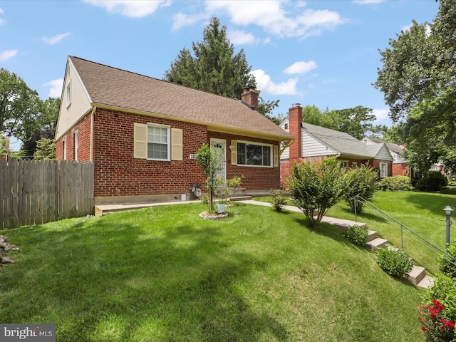 10602 Edgewood Ave, Silver Spring, MD 20901 - view of front of house featuring brick siding, a chimney, and roof with shingles
