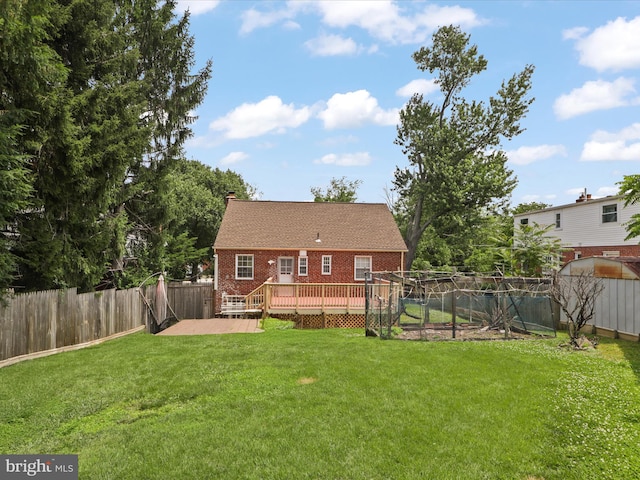 10602 Edgewood Ave, Silver Spring, MD 20901 - rear view of property featuring a fenced backyard, a wooden deck, brick siding, and a chimney