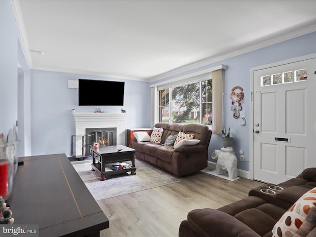 10602 Edgewood Ave, Silver Spring, MD 20901 - living area with crown molding, wood finished floors, and a fireplace