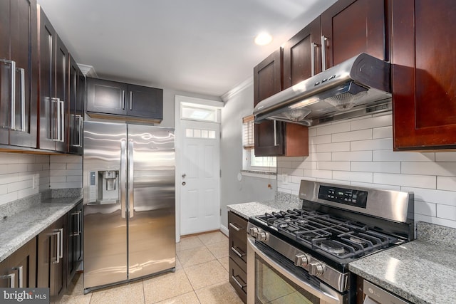 518 Scott St, Baltimore, MD 21230 - kitchen featuring stainless steel appliances, exhaust hood, tasteful backsplash, and light stone countertops