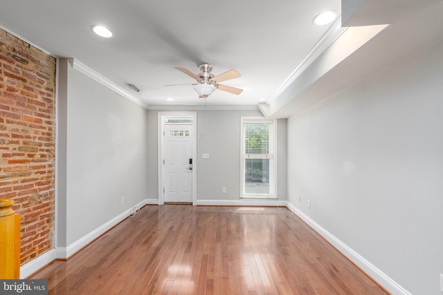 518 Scott St, Baltimore, MD 21230 - foyer with crown molding, wood-type flooring, baseboards, a ceiling fan, and recessed lighting