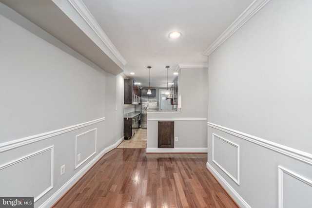 518 Scott St, Baltimore, MD 21230 - unfurnished dining area with crown molding, light wood-style floors, and recessed lighting