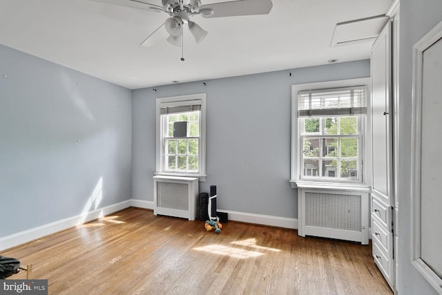 2316 Huidekoper Pl NW, Washington, DC 20007 - empty room featuring radiator heating unit, wood finished floors, and a ceiling fan