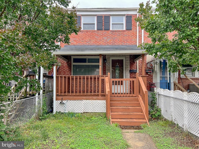 1932 Inverton Rd, Baltimore, MD 21222 - view of front of home with brick siding and a fenced backyard