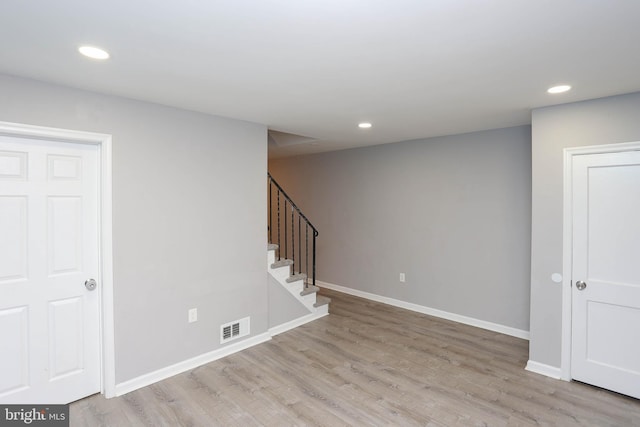 1932 Inverton Rd, Baltimore, MD 21222 - empty room with wood finished floors, stairway, and recessed lighting