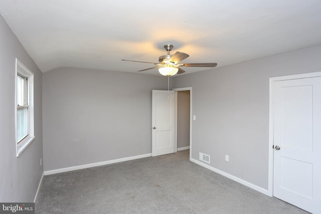 1932 Inverton Rd, Baltimore, MD 21222 - unfurnished bedroom with carpet flooring, a ceiling fan, and vaulted ceiling
