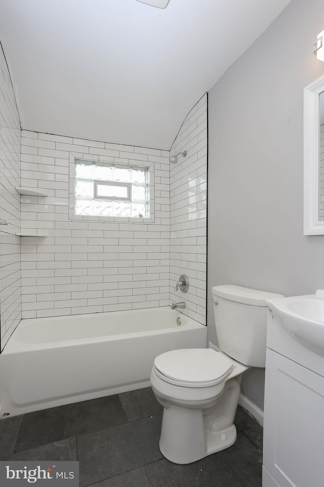 1932 Inverton Rd, Baltimore, MD 21222 - bathroom featuring vanity, shower / washtub combination, tile patterned flooring, and vaulted ceiling