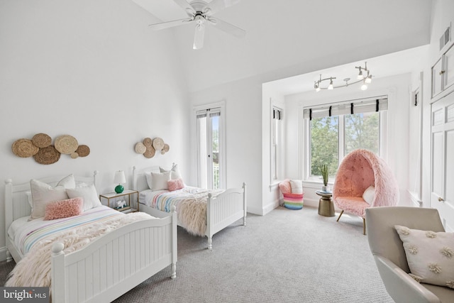 1827 Phelps Pl NW, Washington, DC 20008 - carpeted bedroom with multiple windows, lofted ceiling, baseboards, and a ceiling fan