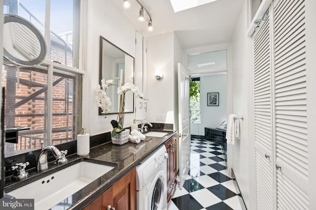 1827 Phelps Pl NW, Washington, DC 20008 - full bathroom featuring washer / clothes dryer, tile patterned floors, double vanity, and a closet
