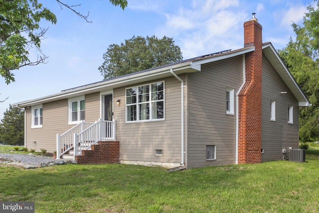 23170 Longview Blvd, Bushwood, MD 20618 - view of front of home featuring a chimney, cooling unit, and a front lawn