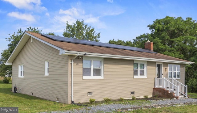 23170 Longview Blvd, Bushwood, MD 20618 - bungalow with solar panels, a chimney, crawl space, and a front yard