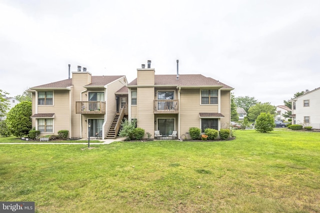 315 Coventry Ct, Mantua, NJ 08051 - rear view of house featuring a chimney, a lawn, a balcony, and stairs