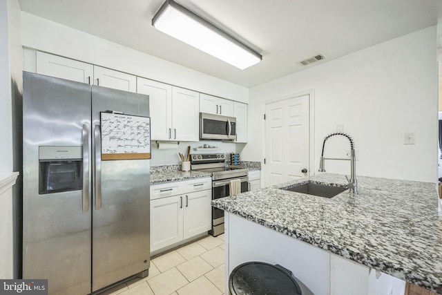 315 Coventry Ct, Mantua, NJ 08051 - kitchen featuring appliances with stainless steel finishes, a sink, light stone counters, and white cabinets