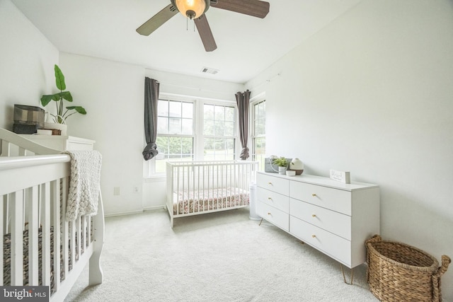 315 Coventry Ct, Mantua, NJ 08051 - bedroom featuring light colored carpet, a crib, baseboards, and a ceiling fan