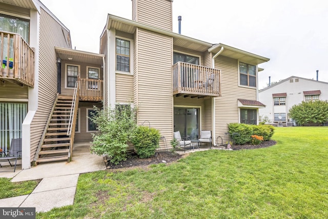 315 Coventry Ct, Mantua, NJ 08051 - back of property featuring a yard, stairs, a balcony, and a chimney