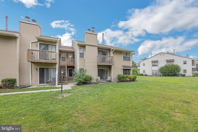 315 Coventry Ct, Mantua, NJ 08051 - back of property featuring a lawn and a chimney