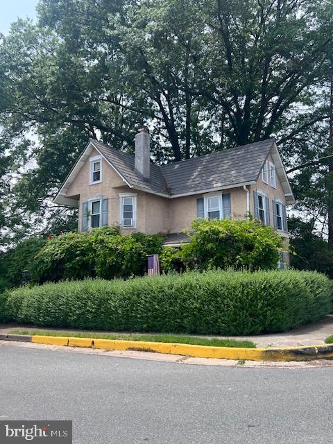 403 Center St, Pottstown, PA 19464 - view of front of home featuring a chimney and stucco siding
