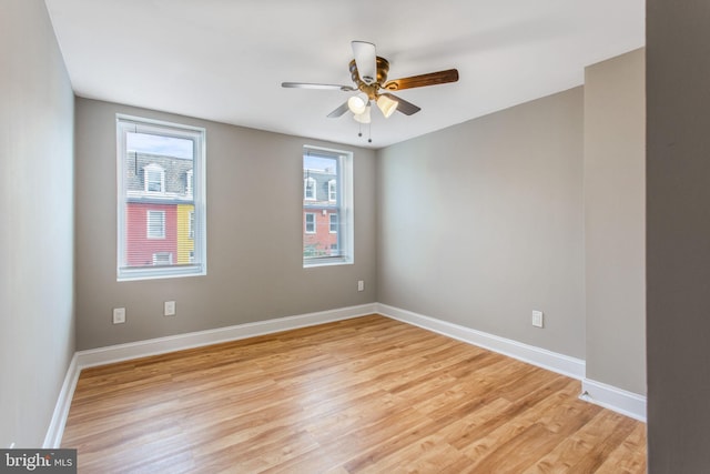 706 Cumberland St, Baltimore, MD 21217 - empty room featuring light wood-style floors, a ceiling fan, and baseboards