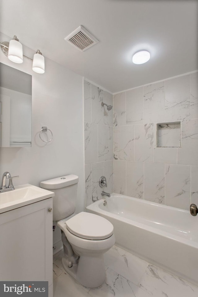 706 Cumberland St, Baltimore, MD 21217 - bathroom with marble look tile flooring, toilet, vanity, and  shower combination