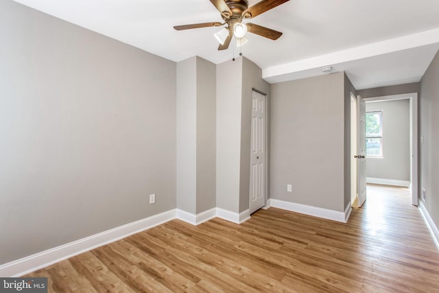 706 Cumberland St, Baltimore, MD 21217 - unfurnished bedroom featuring baseboards, light wood-type flooring, and a ceiling fan