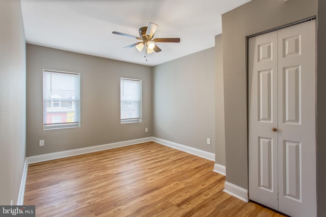 706 Cumberland St, Baltimore, MD 21217 - spare room with ceiling fan, light wood-type flooring, and baseboards