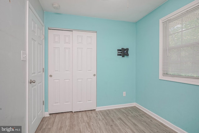650 Penns Grove Auburn Rd, Carneys Point, NJ 08069 - unfurnished bedroom featuring wood finished floors and a closet