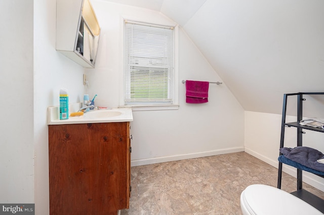 15-17 Locust St, Duncannon, PA 17020 - half bathroom with vaulted ceiling, vanity, toilet, and baseboards